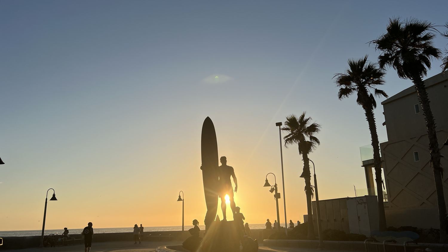 The surfer statue on the Imperial Beach oceanfront at sunset